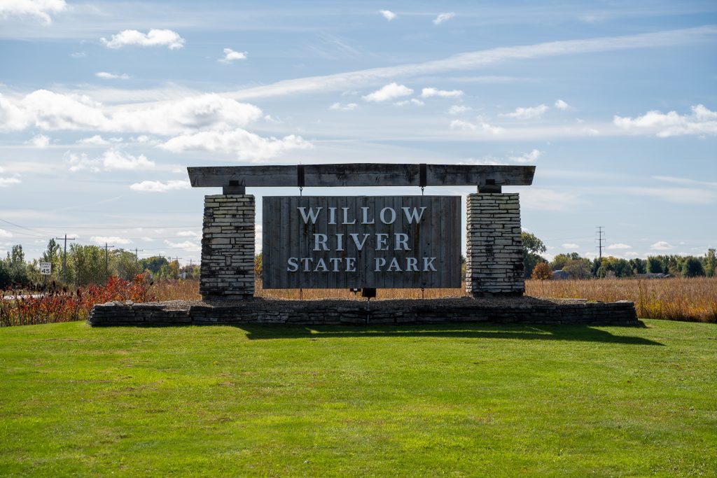 Entrance sign welcomes visitors to Willow River State Park, famous for its waterfall