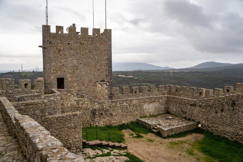 View of the interior ruins of Sesimbra Castle on an overcast winter day