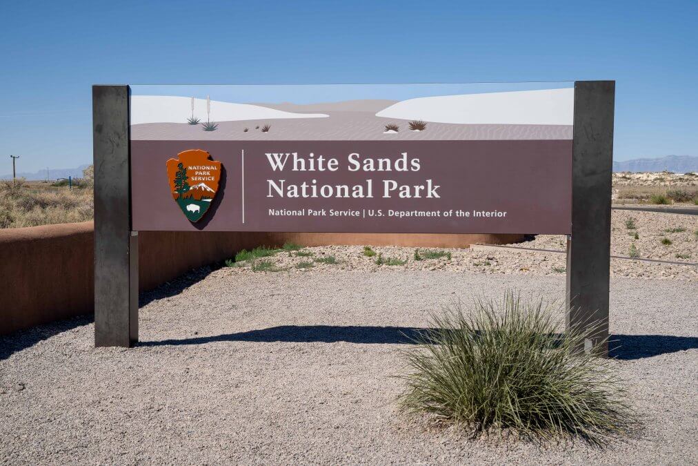 Entrance sign for White Sands National Park on a sunny day